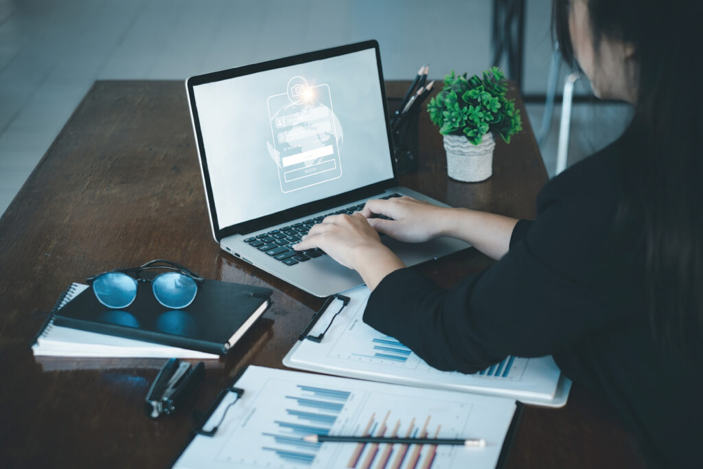 A business woman using laptop computer to cyber security for her saving account, business, technology, future, digital asset Concept