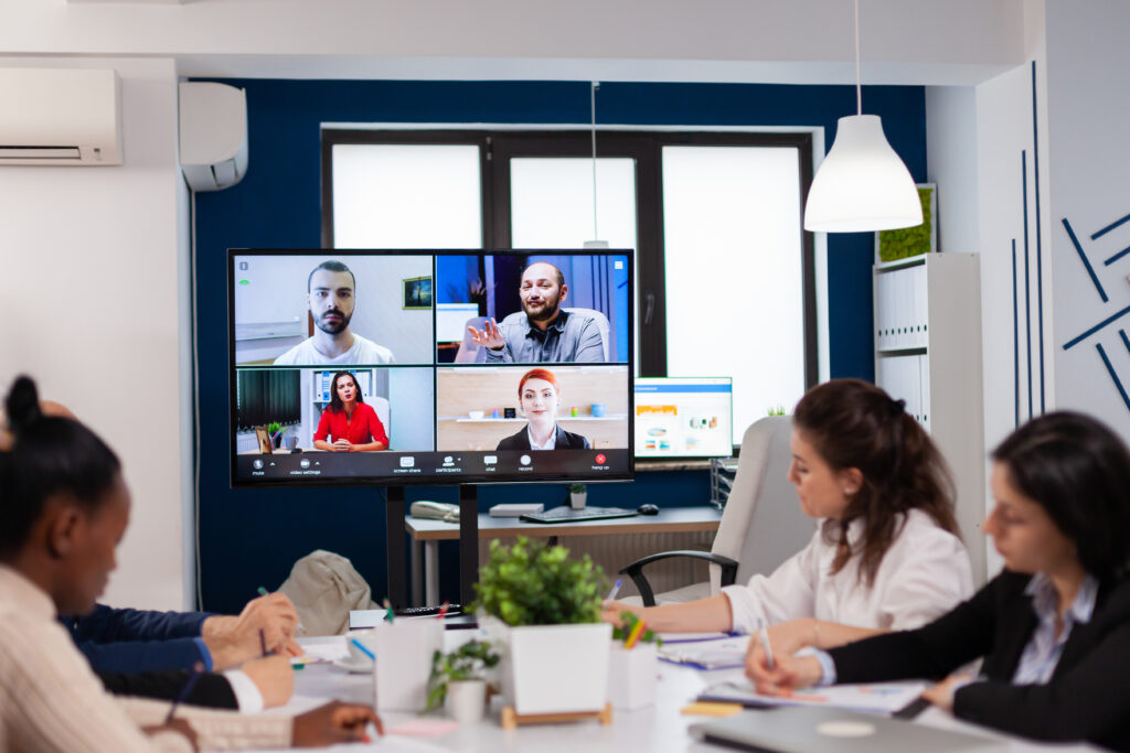 Emplyees workers having webcam group conference with coworkers speaking on video call.